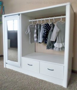 Old entertainment center turned kids armoire