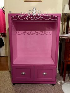 Old entertainment center turned kids armoire