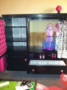 Old entertainment center turned kids armoire