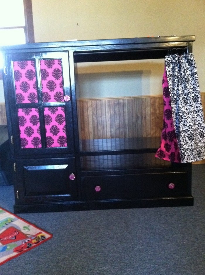 Old entertainment center turned kids armoire