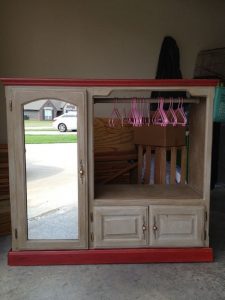 Old entertainment center turned kids armoire