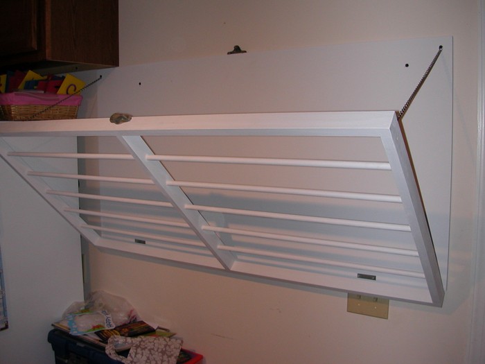 Build a space-saving wall-mounted drying rack for your laundry