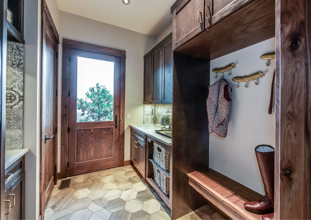 The mud room serves as a practical space for transitioning between seasons.