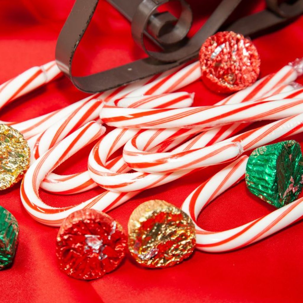 An image of candy canes and chocolate buttercups to be turned into candy sleighs.